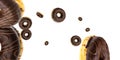 Glazed sprinkles. Chocolate sweet fresh donuts in motion flying on white background. Royalty Free Stock Photo