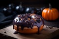 Donut topped with rich chocolate sauce with Halloween