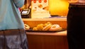 Donut on tray in counter shop, warm tone color, soft focus