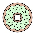 Donut. View from above. The fried delicacy is covered with green icing and sprinkled with sprinkles