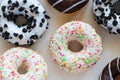 Donut with white glaze and colourful hundreds and thousands