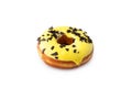 Donut yellow banana glaze isolated on white background. Side view. Chocolate topping