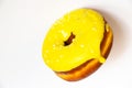 Donut in yellow glaze on an isolated background