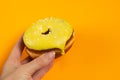 Donut in yellow glaze on an isolated background