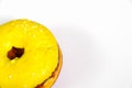 Donut in yellow glaze on an isolated background