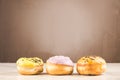 Donuts. Assorted donuts lying on a white table on background with copy space. ÃÂ¡oncept sweet food Royalty Free Stock Photo