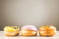 Donuts. Assorted donuts lying on a white table on background with copy space. ÃÂ¡oncept sweet food Royalty Free Stock Photo