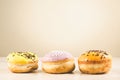 Donuts. Assorted donuts lying on a white table on background with copy space. ÃÂ¡oncept sweet food Royalty Free Stock Photo