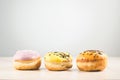 Donuts. Assorted donuts lying on a white table on background with copy space. ÃÂ¡oncept sweet food Royalty Free Stock Photo