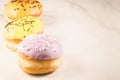 Donuts. Assorted donuts lying on a white table, copy space. Selective focus. ÃÂ¡oncept sweet food Royalty Free Stock Photo