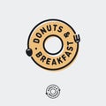 Donuts and Breakfast logo. Cafe bistro logo like donut icon with fork and spoon run around circle.