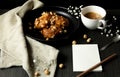 donuts with caramel and hazelnuts, cup of coffee on the rustic table Royalty Free Stock Photo