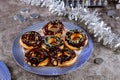 Donuts with chocolate glaze and sprinkle on the table for Jewish holiday of Hanuka.