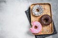Donuts with chocolate, pink glazed and sprinkles Doughnut. White background. Top view. Copy space Royalty Free Stock Photo