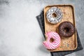 Donuts with chocolate, pink glazed and sprinkles Doughnut. White background. Top view. Copy space