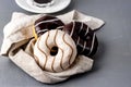 Donuts with Chocolate and Vanillas Icing on Linen Napkin on Gray Background Tasty Dinuts Morning Breakfast Coffee Royalty Free Stock Photo