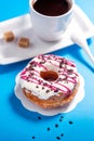 Donuts and coffee on blue background