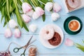 Donuts, coffee and tulips on a blue wooden background. Royalty Free Stock Photo