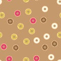 Donuts with colored glaze on pattern background. Pattern donuts with chocolate and fruit glaze. Donut pattern on beige Royalty Free Stock Photo