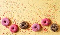 Donuts colorful background on yellow, ceebration Royalty Free Stock Photo