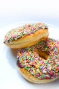 Donuts with colourful sugar sprinkles Royalty Free Stock Photo