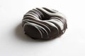 Donuts, covered in black and white chocolate on isolated background Royalty Free Stock Photo