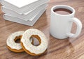 Donuts with cup and books