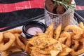 Donuts, fried on hot fan, with the most tasty white and red sauce. Hot and very high-calorie dessert