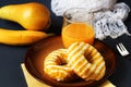 Donuts, fruit and glass of juice on table