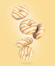 Donuts with glaze frozen in the air on a yellow background
