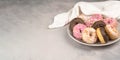 two donuts in a heartshape on a gray background on a white plate. Concept for Valentine's Day. flatly space for text Royalty Free Stock Photo