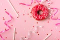 Donuts with icing on pastel pink background with copyspace. Sweet donuts. Royalty Free Stock Photo