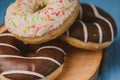 Donuts lying on the table. blue background Royalty Free Stock Photo