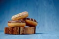 donuts lying on the table. blue background Royalty Free Stock Photo