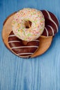 donuts lying on the table. blue background Royalty Free Stock Photo