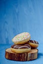 donuts lying on the table. blue background Royalty Free Stock Photo