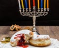 Donuts and a menorah for Hanukkah Royalty Free Stock Photo