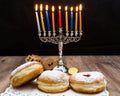 Donuts and a menorah for Hanukkah Royalty Free Stock Photo