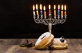 Donuts and a menorah for Hanukkah Royalty Free Stock Photo