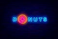 Donuts neon signboard. Shiny emblem for bakery. Sweet bar. Night bright logo. Isolated vector stock illustration