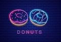 Donuts neon symbols Vector. Glowing sign dark background. Shinning billboard or menu templates