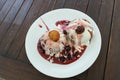 Donuts pancakes with cream and cherry jam Royalty Free Stock Photo