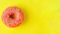 Donuts on pastel yellow background.