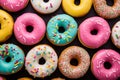 Donuts pattern. Top view of assorted glazed donuts. Colorful donuts