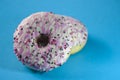 Donuts pink glazed on blue background. Closeup