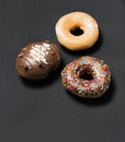 Donuts prepared with flour, glaze, chocolate and colorful sparks