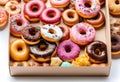 donuts set in paper box on white Royalty Free Stock Photo