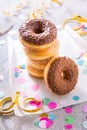 Donuts with streamers and confetti. Donuts for carnival and party Royalty Free Stock Photo