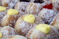 Donuts at street food market in Thailand, closeup. Tasty doughnuts with jam, chocolate and condensed milk Royalty Free Stock Photo