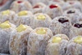 Donuts at street food market in Thailand, closeup. Tasty doughnuts with jam, chocolate and condensed milk Royalty Free Stock Photo